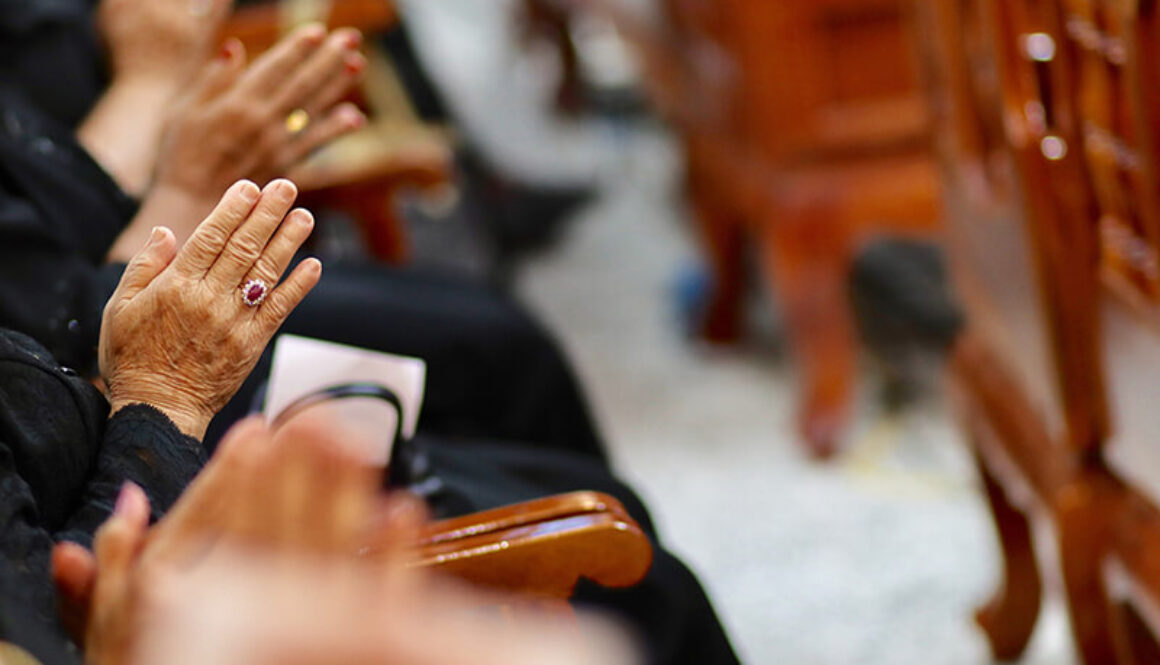 midsection-people-praying-church (1)