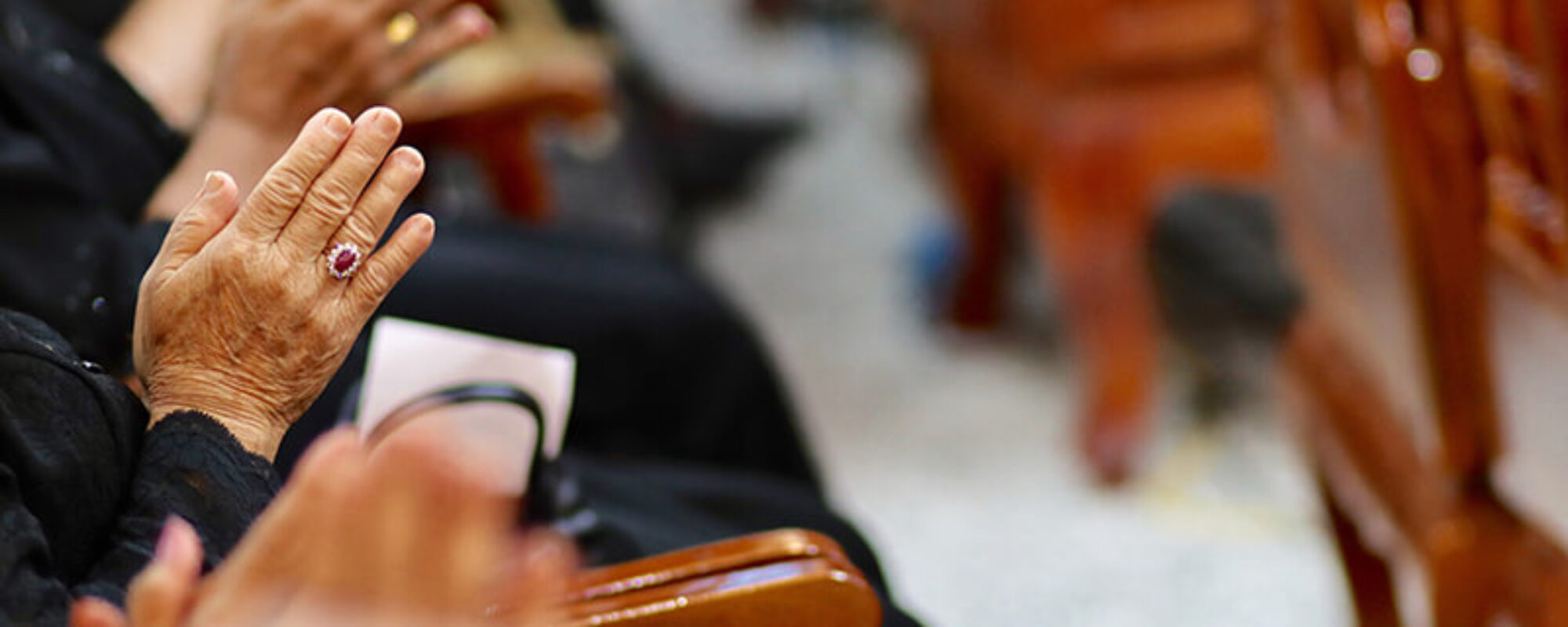 midsection-people-praying-church (1)