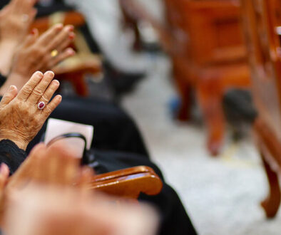 midsection-people-praying-church (1)